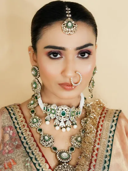 This is a perfect example of a classic North Indian bridal look. You will learn the nuances of creating makeup that complements heavy kundan and polki jewelry.