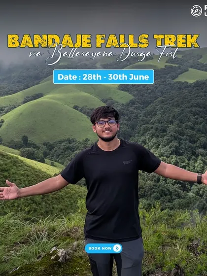 A trekker embraces the wide open space and stunning views on the Bandaje Falls trek.