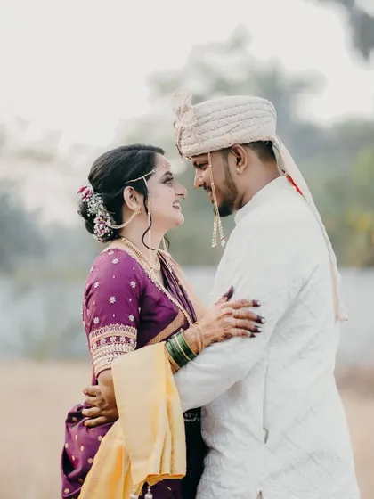 A classic romantic portrait of the couple looking into each other's eyes.