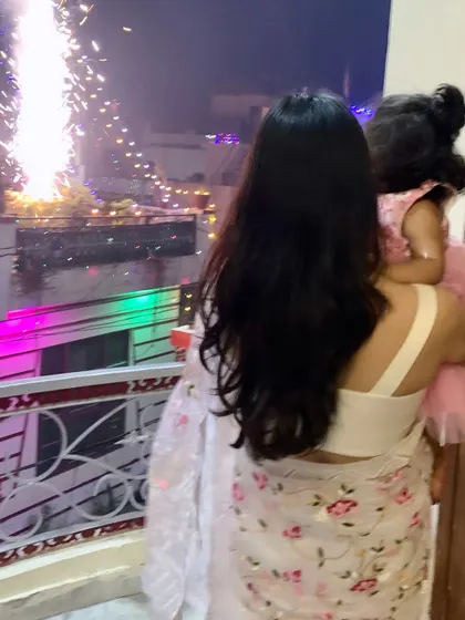 Holding my daughter as we watch the Diwali fireworks. Creating these memories with her is everything.