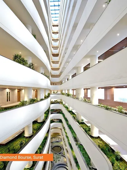 The interior of the Surat Diamond Bourse reveals a vast, multi-level space designed for community and commerce. The flowing balconies and integrated planters create a vibrant internal ecosystem, demonstrating how we design for human interaction on a massive scale.