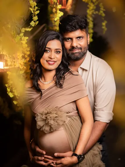 A cozy and intimate couple's portrait, with the warm lighting of the garden creating a romantic and gentle mood.