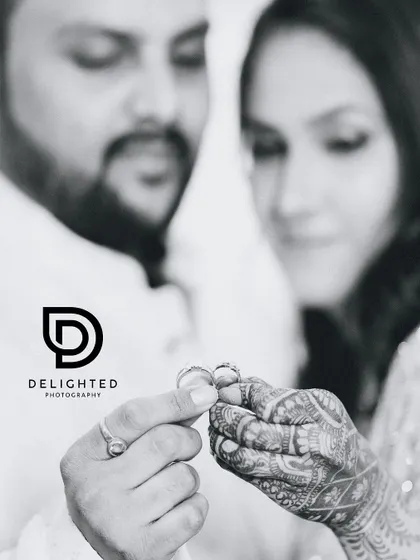 A classic black and white shot focusing on the wedding rings. This symbolic photo captures the promise of forever that is made during the ring ceremony.