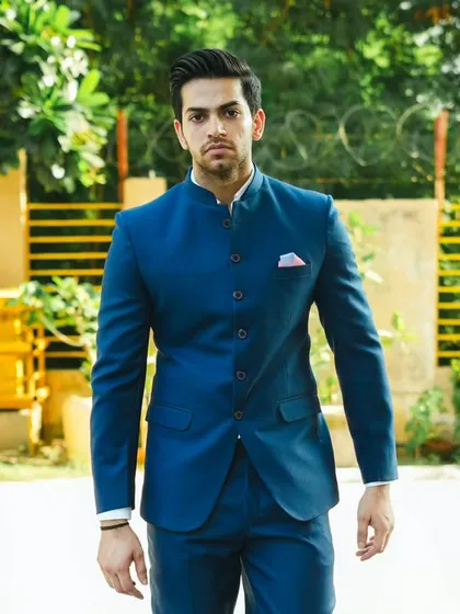 A confident stance in our royal blue Jodhpuri suit. It's an outfit that commands attention.