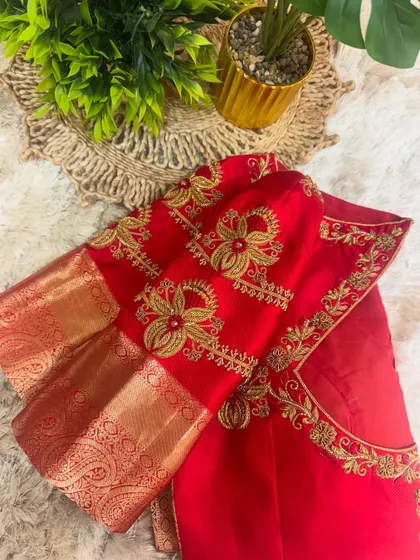 This red blouse features a different embroidery pattern on the back, with beautiful floral motifs.