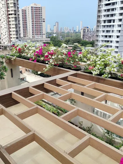 The intricate design of the pergola planter boxes is a key feature of this terrace, allowing for creative planting arrangements.