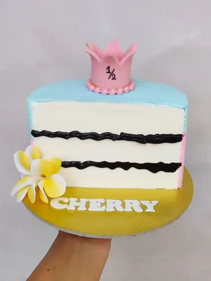 A half-birthday cake, which is literally half a cake. It's a fun and quirky way to celebrate the six-month milestone.