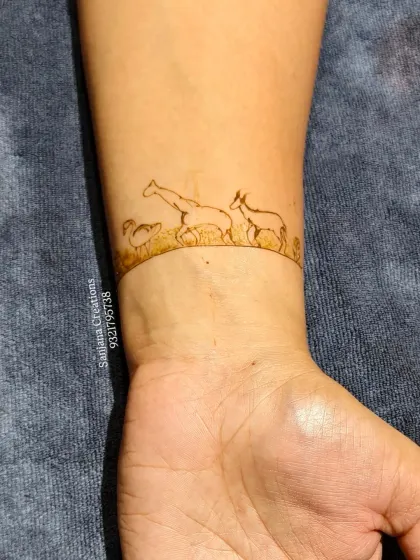 A simple and elegant safari-themed band for the wrist, featuring giraffes and other animals. Perfect for a minimalist take on a themed design.