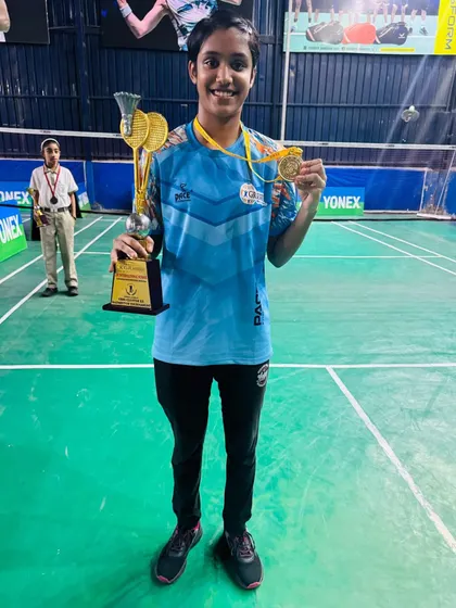 Celebrating another gold medal win at the CBSE tournament. This player's hard work in training paid off on the podium, holding her trophy and medal high.