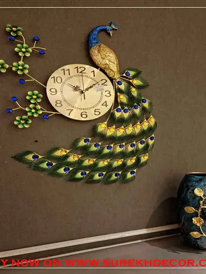 Add a touch of nature-inspired elegance with this peacock wall clock. The design showcases a peacock perched on a flowering branch, combining a functional clock with a beautiful piece of metal art, perfect for adding color and life to your decor.
