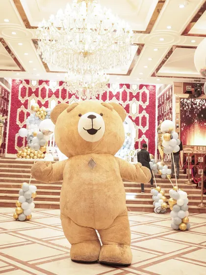 A giant, cuddly teddy bear mascot was the star of the show at this First Lohri celebration, delighting guests of all ages.