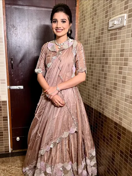 A full-length shot of the bride, showcasing her unique and stylish sangeet outfit.