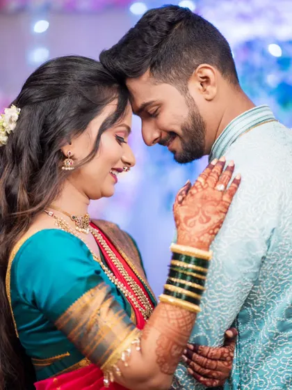 An intimate forehead-to-forehead pose, capturing the deep connection and happiness of the couple.