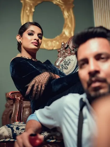 A powerful, fashion-inspired pose from a vintage-themed shoot. The unique angle and the couple's confident expressions give this portrait a high-fashion, editorial feel.