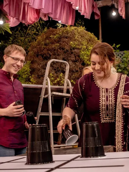 More fun and games at the Mehendi, with guests fully engaged in a playful competition.