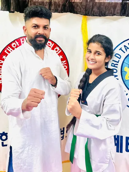 Another proud student with her new green belt.