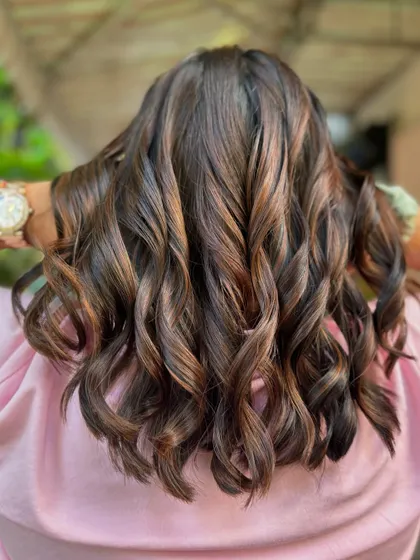 The waves in this brunette look really highlight the different shades of brown. A beautiful, low-maintenance style. (No filter)