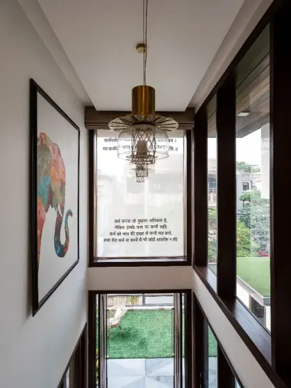 The house echoes the essence of Indian arts, crafts, and spirituality through its thoughtful design and material palette.