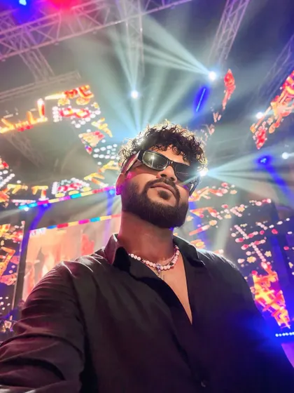 A selfie from the stage, with the incredible lighting and production in the background. I thrive in this environment.