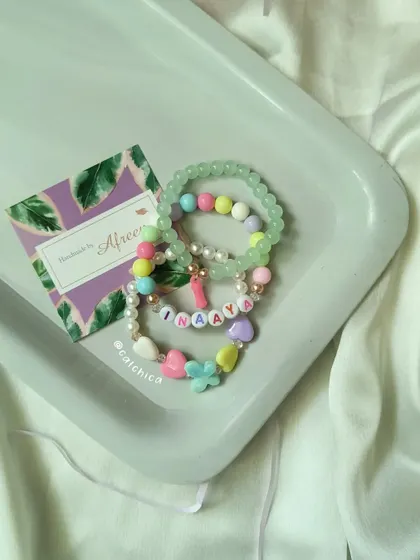 Another view of the beautiful bracelet stack we created for Inaaya, combining different textures and charms.