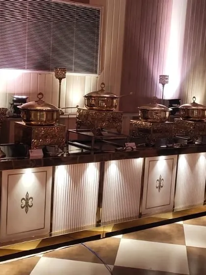 Another angle of the main course buffet, showcasing the long line of copper chafing dishes that keep the food perfectly warm for guests throughout the event.