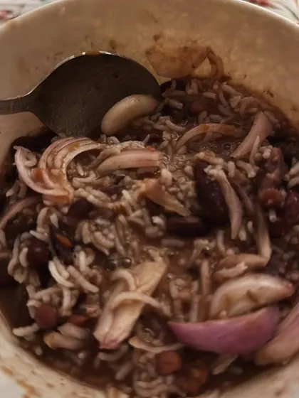A hearty bowl of rajma chawal (kidney beans and rice) with onions. Comfort food can absolutely be part of a healthy diet.