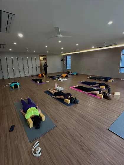 A restorative session at the end of a workshop. We used blocks to support the body in a gentle backbend, allowing for deep release and rest.