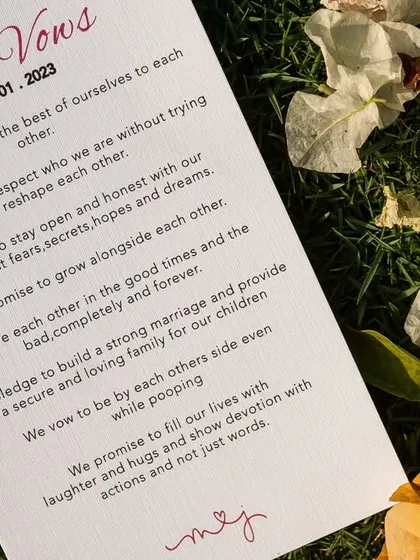 A beautifully printed card sharing the couple's personal vows, a meaningful keepsake and a touching detail for guests to read during the ceremony.