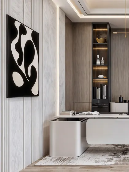 This view of the office highlights the abstract art and the fluted marble wall, adding texture and artistic flair to the corporate space.