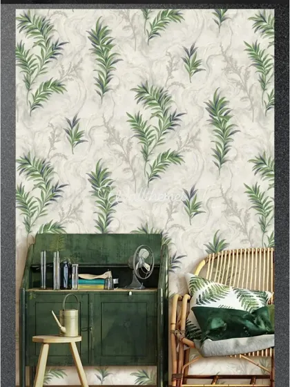 A delicate wallpaper with green fern-like leaves, shown in a room with natural wood and rattan furniture.