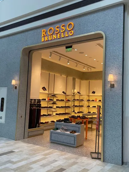 The storefront for Rosso Brunello in Lulu Mall, Lucknow. The arched entrance and terrazzo-finish facade create a modern yet soft and inviting look.