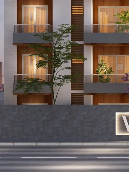 A view of the ground level and entrance of VN Vista, showing the compound wall and landscaping that create a welcoming approach.