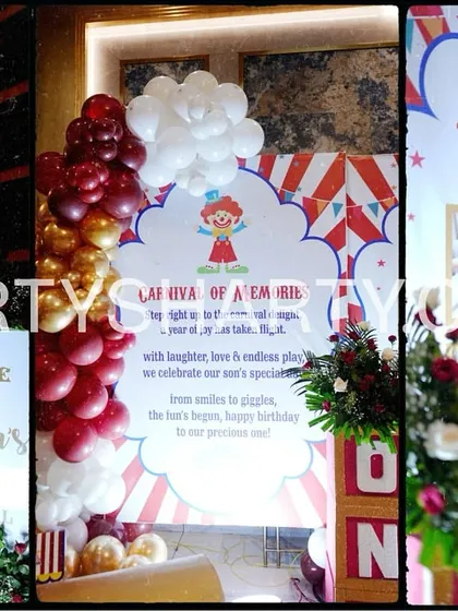 A collage of personalized details from a carnival party, including a welcome sign, a milestone board, and a photo display of the birthday boy.