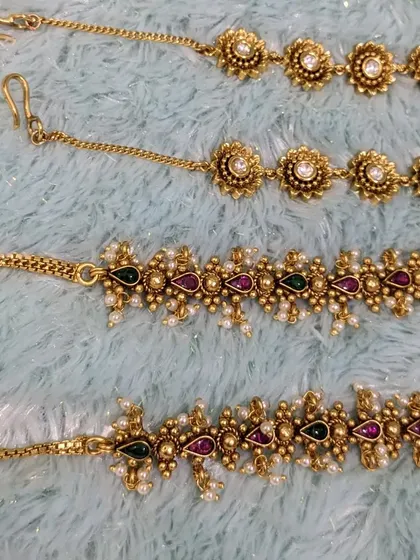 Another view of the kemp-stone and floral ear chains.