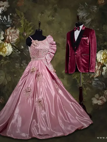 This pairing showcases elegance in every detail. The deep red of the groom's velvet suit creates a rich contrast with the soft peach of the bride's gown, making for a memorable couple's portrait.