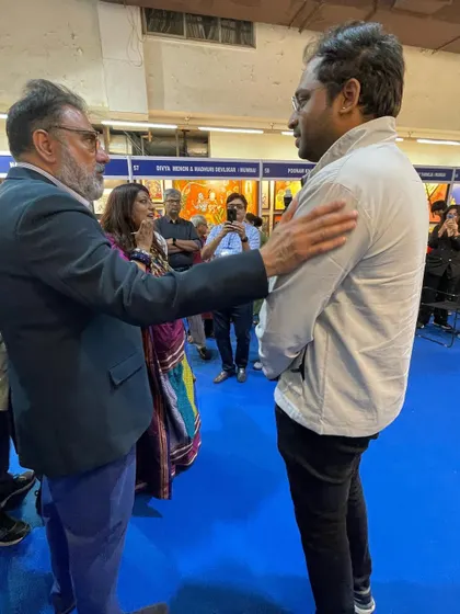 A candid moment of conversation with a respected guest during one of my exhibitions.