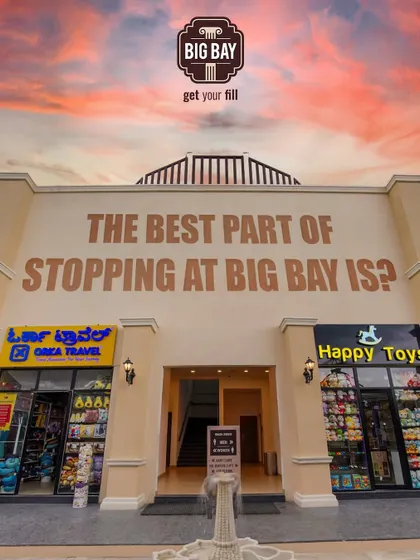 What's the best part of stopping at Big Bay? This image shows our travel and toy shops, just a couple of the many things our visitors love.