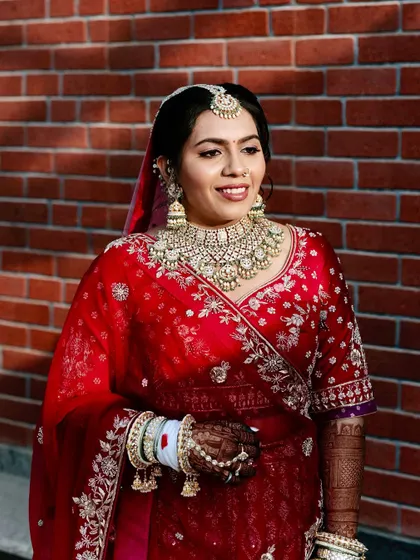 A beautiful candid of the bride. Her glowing skin and soft smile are the highlights of this traditional look.