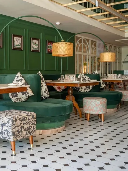 This is a project I completed for "The Drawing Room" by Smoke House Deli, featuring custom-made furniture that brings the entire space to life. I crafted the plush green velvet banquettes, patterned ottomans, and sturdy dining tables to create an enchanting and comfortable dining experience.