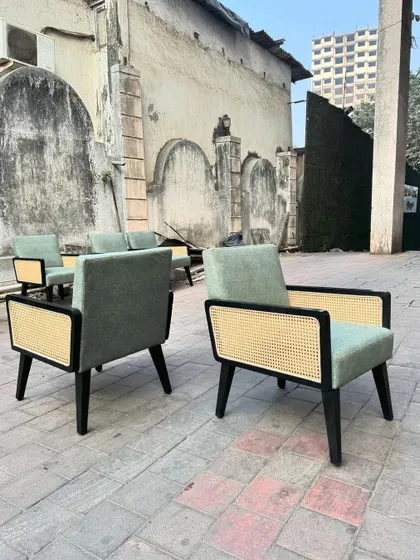 The back and side view of the chairs, showcasing the cane panel detail.