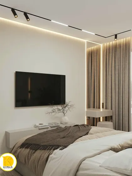A view of the TV wall in the same bedroom, featuring a simple floating console.