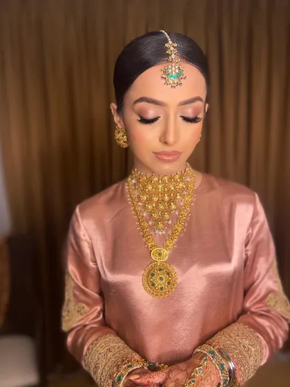 A close-up of the Anand Karaj makeup. The focus is on clean, glowing skin and softly defined eyes, creating an angelic and peaceful look for the daytime ceremony.
