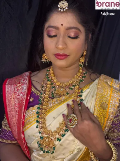 A close-up on the makeup, showing a soft-glam eye look with a pop of color on the lips, suitable for wedding ceremonies.