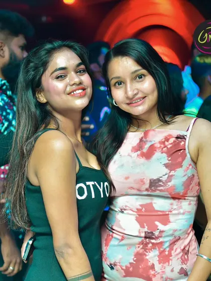 Guests smiling for the camera, enjoying the vibrant party atmosphere. My goal is to make sure everyone leaves with a smile.