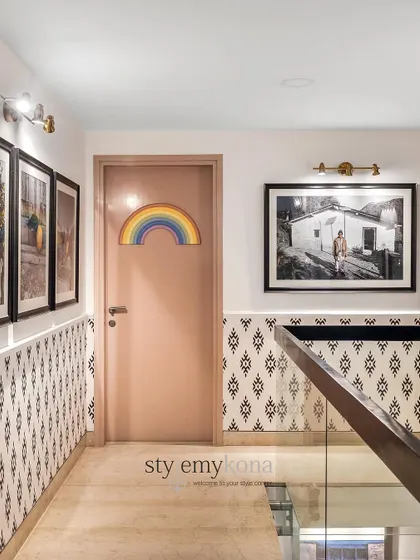 Staircases can tell real stories. For this wall, we framed photos of our client's ancestral home in Uttarakhand, creating an emotional connection to their roots and their journey.