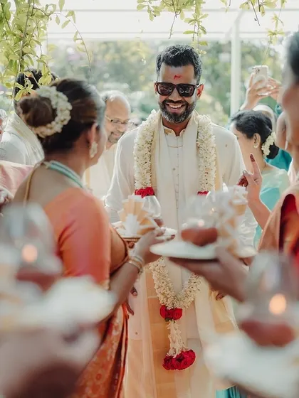 The groom's grand entrance, surrounded by family in a traditional welcoming ritual. I coordinate every part of the ceremony to ensure it flows smoothly and joyfully.
