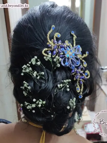 Baby's breath adds a dreamy and delicate quality to any hairstyle. I wove sprigs of it through this messy updo, along with a beautiful blue and gold hair accessory, for a client celebrating her 25th wedding anniversary.