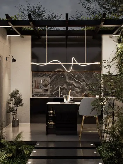 A luxury terrace design featuring a sleek, modern outdoor kitchen and bar. The space is defined by its dramatic marble accent walls, designer lighting, and a stepping stone path through lush ground cover.