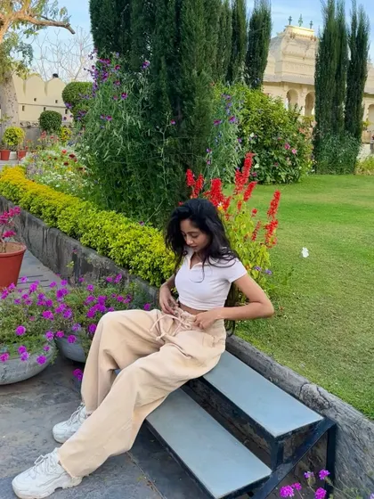 Taking a moment to chill on a bench in a beautifully manicured garden in India. We balance our itineraries with plenty of time for relaxation.