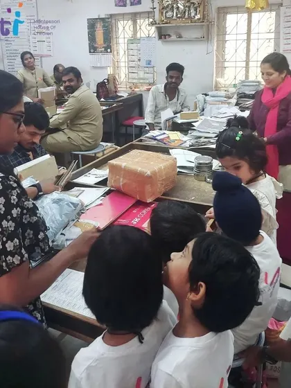 Inside the post office, children observe the process of sorting mail and parcels, getting a behind-the-scenes look at this important community service.